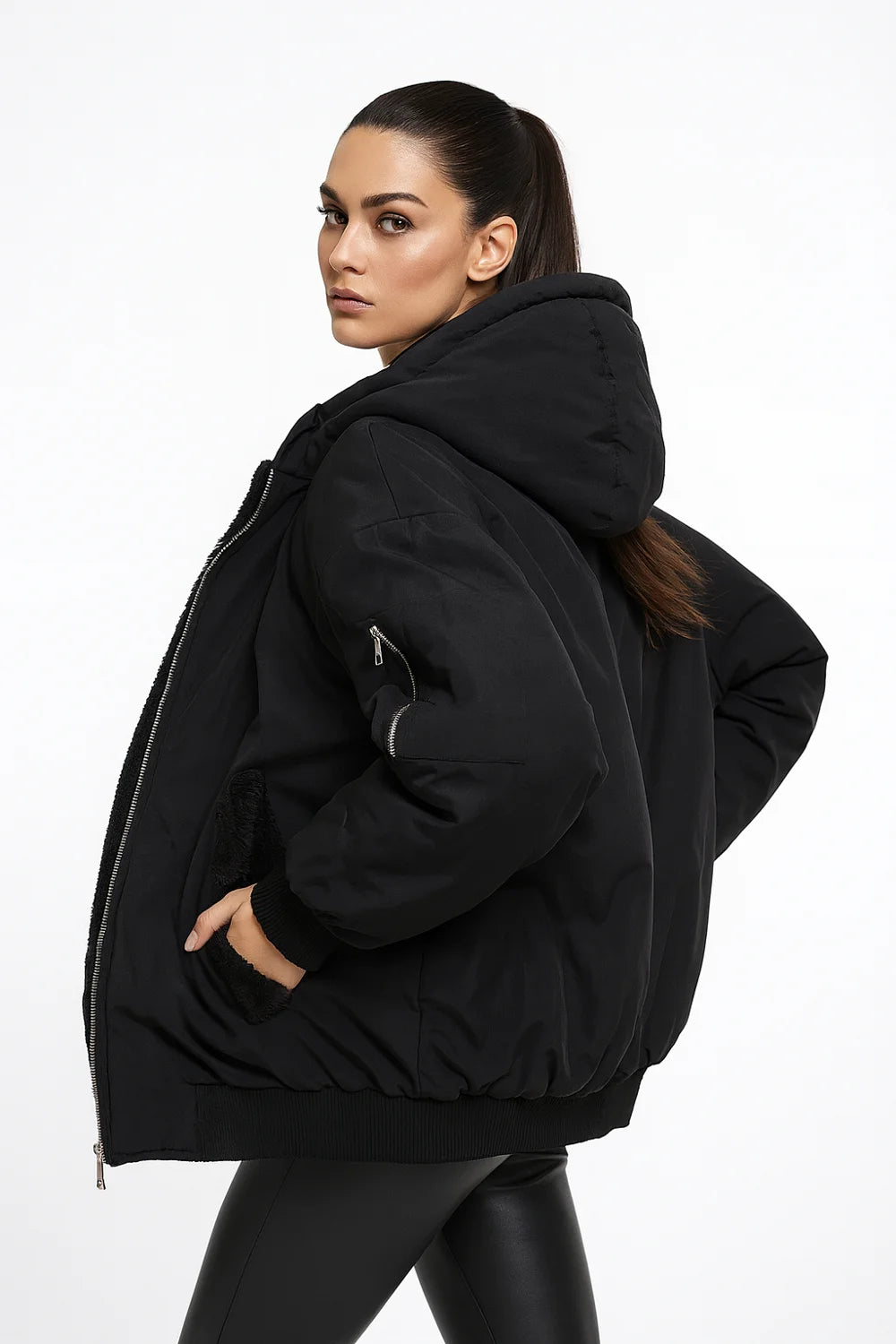 Black puffer jacket with hood and faux shearling lining, cozy winter outerwear for women.